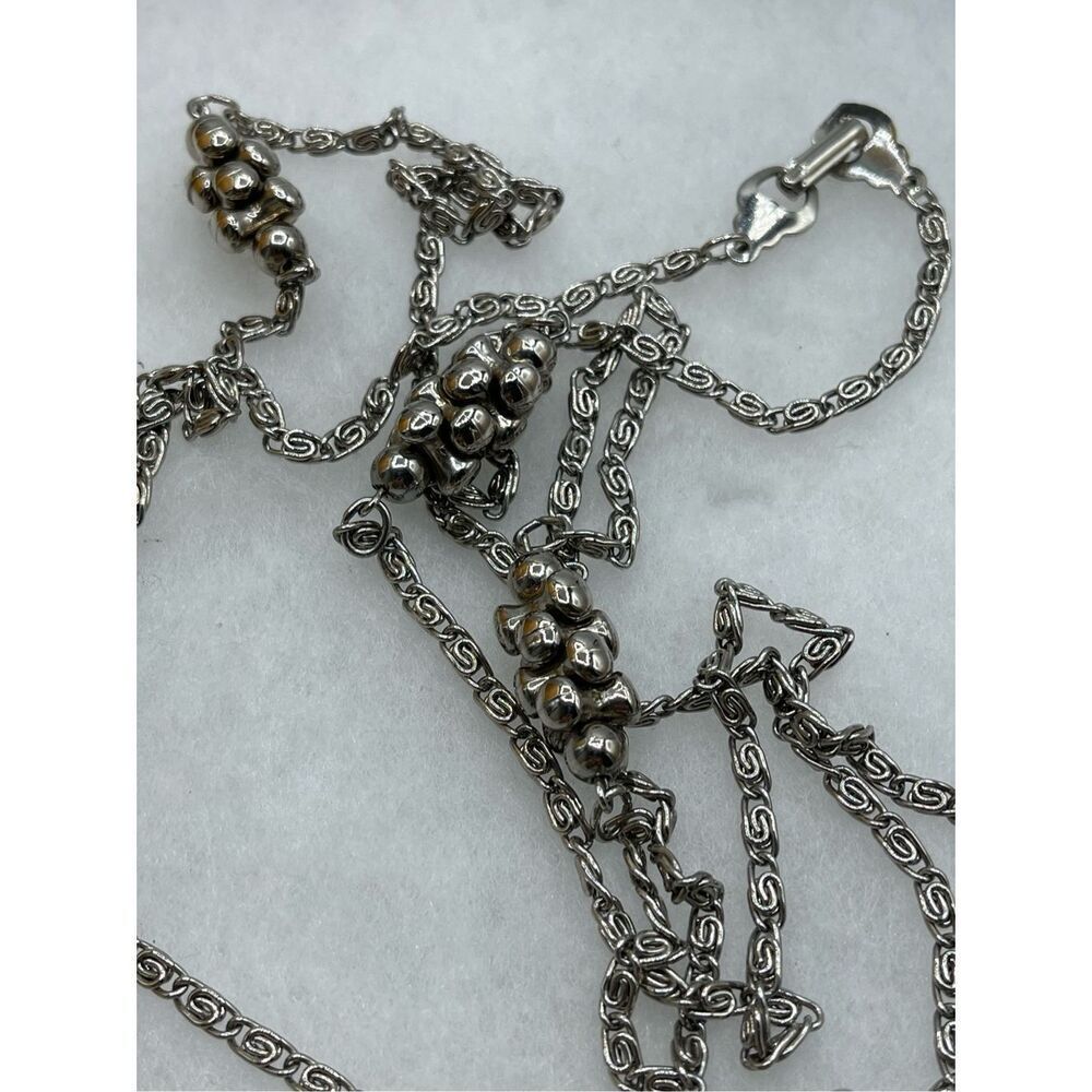 Vintage paper clip link chain with intermittent silver beaded clusters. 28” long